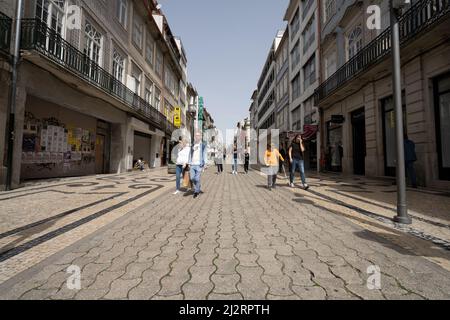 Porto, Portugal. March 2022.   people strolling in Santa Catarina street in the city center Stock Photo