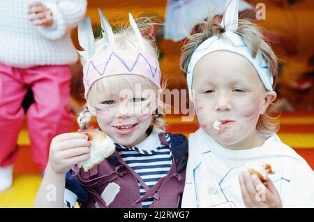 Golcar Nursery school children pictured during a Wild West fund day and barbecue, organised as a treat after they won a prize for their float at the Golcar gala, 2nd July 1992. Munching Mohicans! Shelley Cockroft and Matthew Ellam stoke up with vittles Stock Photo