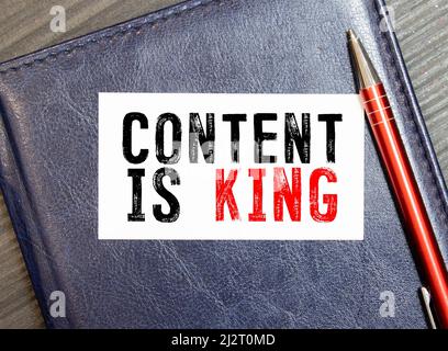 CONTENT IS KING message on the card shown by a man. Stock Photo