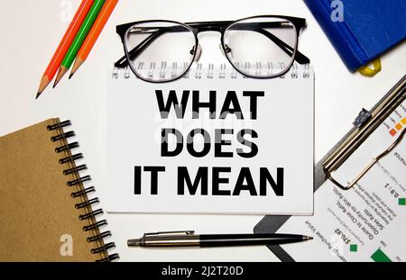 Word writing text What Does It Mean question. Business concept for Give me the meaning of something Definition Written black and red text and number o Stock Photo