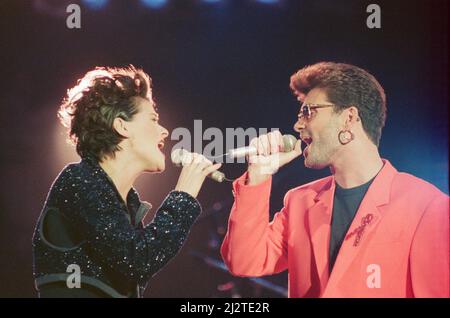 George Michael and Lisa Stansfield perform These Are The Days of Our Lives at The Freddie Mercury Tribute concert at Wembley Stadium in 1992. Picture taken Easter Monday 20th April 1992 Stock Photo