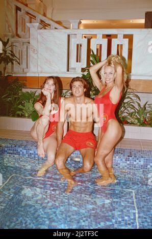 Baywatch stars in a photocall, in London, forthe TV series now appearing on British Television.  Picture shows Pamela Anderson (blonde) Alexandra Paul (brunette) and David Charvet  Picture by Arnold Slater  Picture taken 21st January 1993 Stock Photo