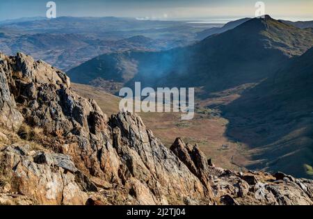 Looking south,bright,haze due to smoke from crop burning,clear, sunny late afternoon in March,warm colors and textured rock pinnacles. Stock Photo