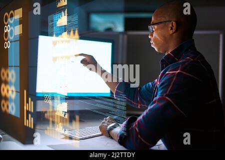Hes getting deep into the code. Cropped shot of a young male programmer working on computer code in his office. Stock Photo