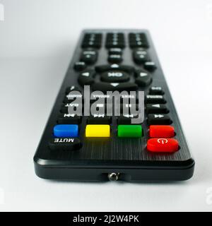 TV remote control. Infrared light-operated television, music system, dvd reader, satellite receiver remote control. Isolated on white background. Focu Stock Photo