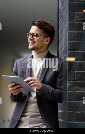 Portrait of successful business man, entrepreneur working in urban background Stock Photo