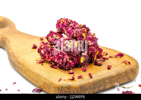 Turkish Delight. Rose Petal Fingers with Pistachios. Close-up. Traditional Turkish cuisine delicacies. Stock Photo