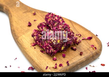 Turkish Delight. Rose Petal Fingers with Pistachios. Close-up. Traditional Turkish cuisine delicacies. Stock Photo