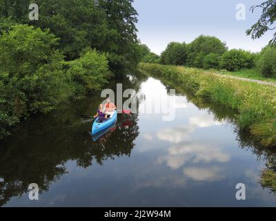 Netherlands, on a tributary from the Lek river, a couple is canoeing . Stock Photo