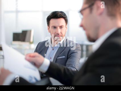 close up. two employees discussing business documents Stock Photo
