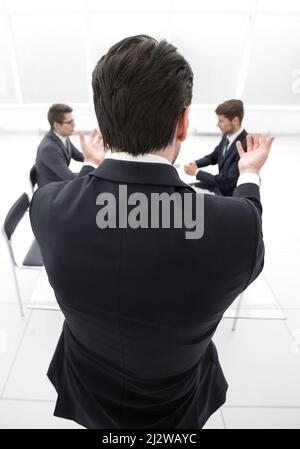 rear view.businessman holds a working meeting. Stock Photo