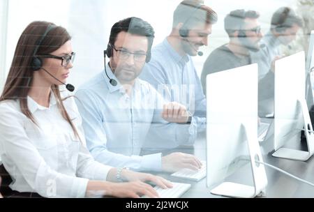 support operators in the workplace in the call center Stock Photo