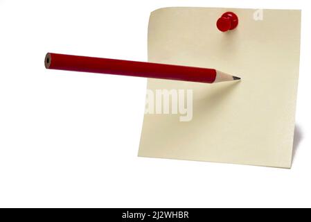 Close up of yellow postit note sheet with red pin and pointed pencil which points to write on the against sheet white background concept for notes Stock Photo