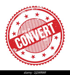 CONVERT text written on red grungy zig zag borders round stamp. Stock Photo