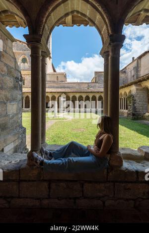 Young people in the Cordeliers Cloister monastery in the wine town of Saint Emilion, Unesco World Heritage, France Stock Photo