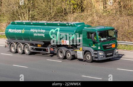 Morrisons green white supermarket petrol tanker, tanker truck, gas truck, fuel truck;  Haulage delivery trucks, lorry, transportation, truck, cargo carrier, MAN vehicle, European commercial transport, industry, M6 at Manchester, UK Stock Photo