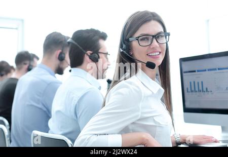 employee of the business center using the computers to analyze the data Stock Photo