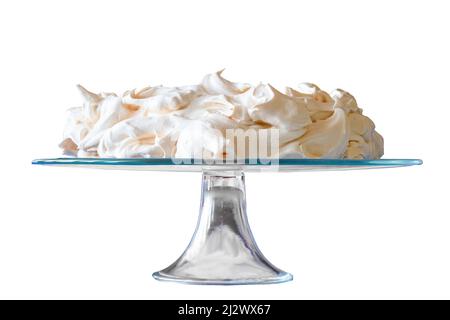 Meringue cake on a glass base. Isolated background. Stock Photo