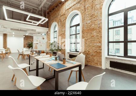Empty work room in modern coworking in loft style Stock Photo