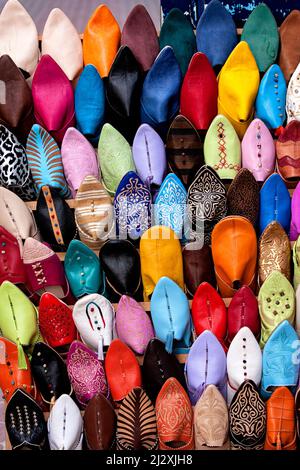 Soft leather Moroccan colourful slippers for sale in the souk of Marrakesh, Morocco Stock Photo
