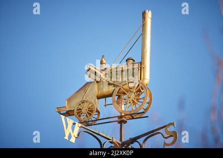 Crewe, Cheshire.  Crewe Cheshire East Register Office, weather vane with gold Stevenson’s Rocket Stock Photo