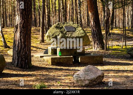 Palmiry, Poland - March 20, 2022: Orlik Stone - Kamien Orlika symbolic stone memorial of fallen cadet Roman Orlik from World War II polish tank defens Stock Photo
