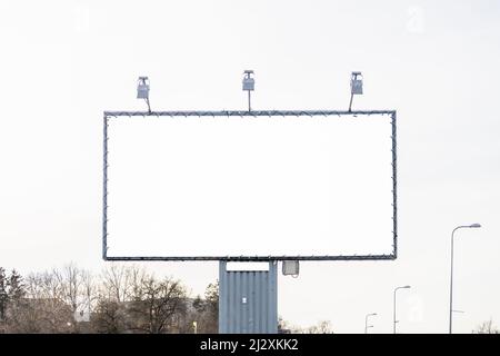 Mockup large white blank advertising billboard or promotion against the sky background Stock Photo