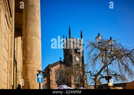 Macclesfield Town Hall and designated Grade II* listed building St Michael & All Angels Church with Sunday street market Stock Photo