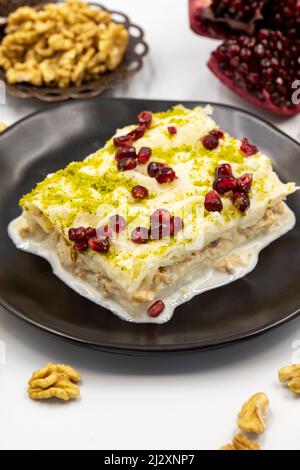 Gullac dessert ( milk dessert ) on a white background. Traditional Turkish dessert. close up Stock Photo