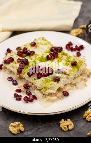 Gullac dessert ( milk dessert ) on a dark background. Traditional Turkish dessert. close up Stock Photo