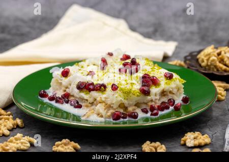 Gullac dessert ( milk dessert ) on a dark background. Traditional Turkish dessert. close up Stock Photo