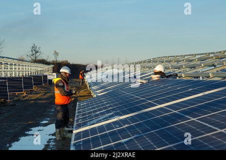 Installation of a solar photovoltaic power plant in Lafitte-Vigordane (south-western France) on December 13, 2021 Stock Photo