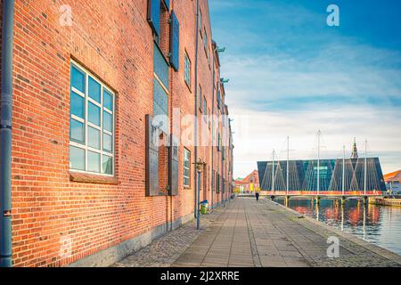 Old brick house on the embankment of the canal leading to the Five Circles Pedestrian Bridge. Copenhagen, Denmark Stock Photo