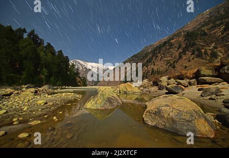 Himalayas in Moonlight, Bagori, Harsil valley, Gangotri, Uttarakhand, India Stock Photo