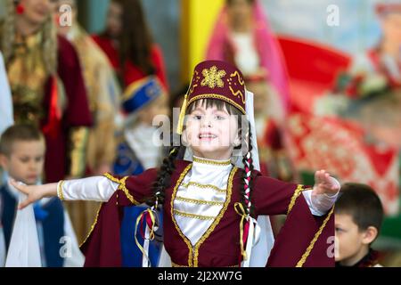 A girl in a national Georgian costume is dancing. Stock Photo