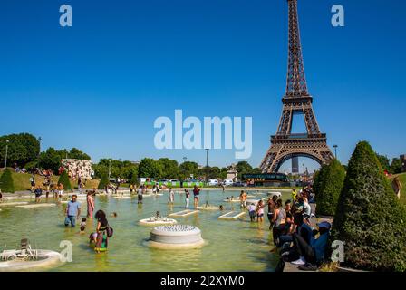 Paris, France, Crowd of Young Tourists Bathing in Pool At Trocadero Gardens, with Eiffel Tower, Heat Wave, Summer Vacation Stock Photo