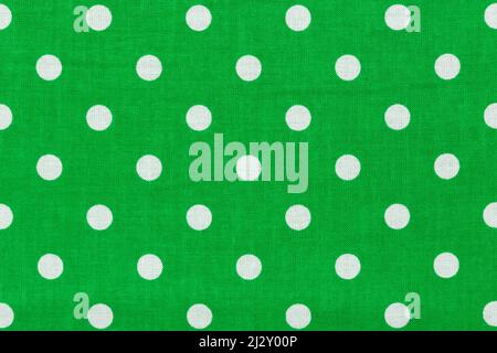 Tile pattern with white polka dots on green background. Stock Photo