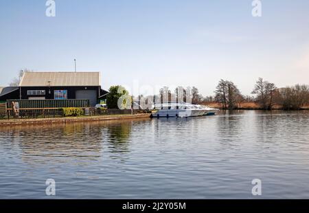 A boatyard on the River Bure on the Norfolk Broads downstream of The Ferry Inn at Horning, Norfolk, England, United Kingdom. Stock Photo