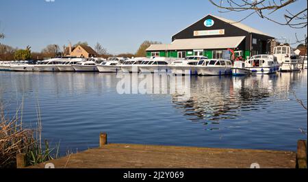 A view of the Ferry Marina on the River Bure on the Norfolk Broads downstream of the Ferry Inn at Horning, Norfolk, England, United Kingdom. Stock Photo