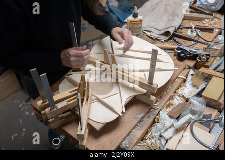 In Franck Cheval’s workshop, luthier in Saint-Michel-sur-Savasse (south-eastern France). Guitar making in the workshop of stringed-instrument maker Fr