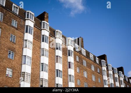 Art Deco apartments, London, UK. A low angle, diagonal view of a block of 1930's flats in West London, England. Stock Photo