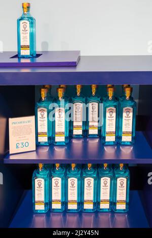 Bottles of Bombay Sapphire gin for sale on display in Gin Shop at Bombay Sapphire Gin Distillery, Laverstoke Mill, Laverstoke, Hampshire, UK in March Stock Photo
