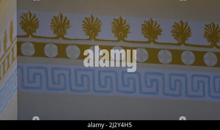 Neoclassical mansion hand painted exterior wall with Antefix and Meander decorations in Andritsaina, Ilia Greece. Stock Photo