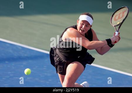 Latvian tennis player Jelena Ostapenko playing a backhand shot at the Dubai Tennis Championships 2022, Dubai, United Arab Emirates. Stock Photo