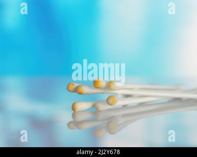 Used ear cotton swabs isolated on blurry background. Hygiene and health care. Close-up Stock Photo