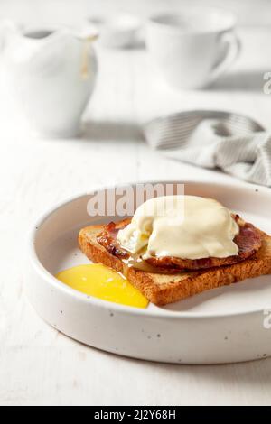 eggs benedict on a white plate Stock Photo