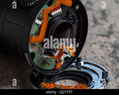 broken camera lens showing internal printed circuit board and electronics Stock Photo