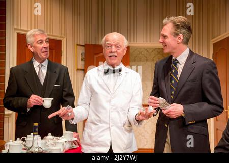 l-r: Jeffrey Holland (Manager), Ray Cooney (Waiter), Michael Praed (Richard Willey) in TWO INTO ONE by Ray Cooney at the Menier Chocolate Factory, London SE1  19/03/2014 design: Julie Godfrey  lighting: Paul Anderson  director: Ray Cooney Stock Photo