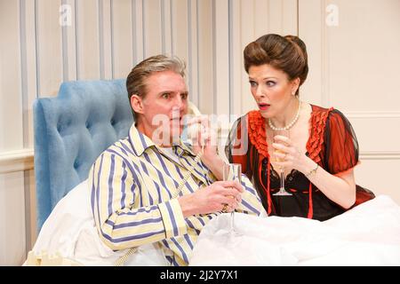 Michael Praed (Richard Willey), Josefina Gabrielle (Pamela Willey) in TWO INTO ONE by Ray Cooney at the Menier Chocolate Factory, London SE1  19/03/2014 design: Julie Godfrey  lighting: Paul Anderson  director: Ray Cooney Stock Photo