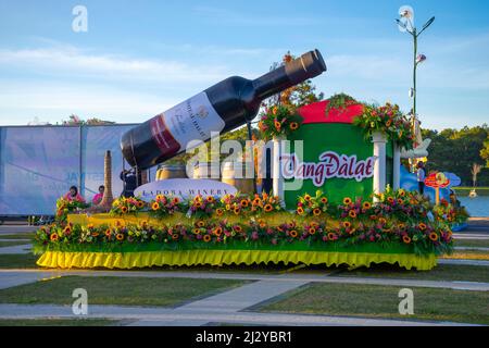 DALAT, VIETNAM - DECEMBER 28, 2015: An art installation with a huge bottle of wine in the presentation of the Dalat plant at the flower Festival Stock Photo